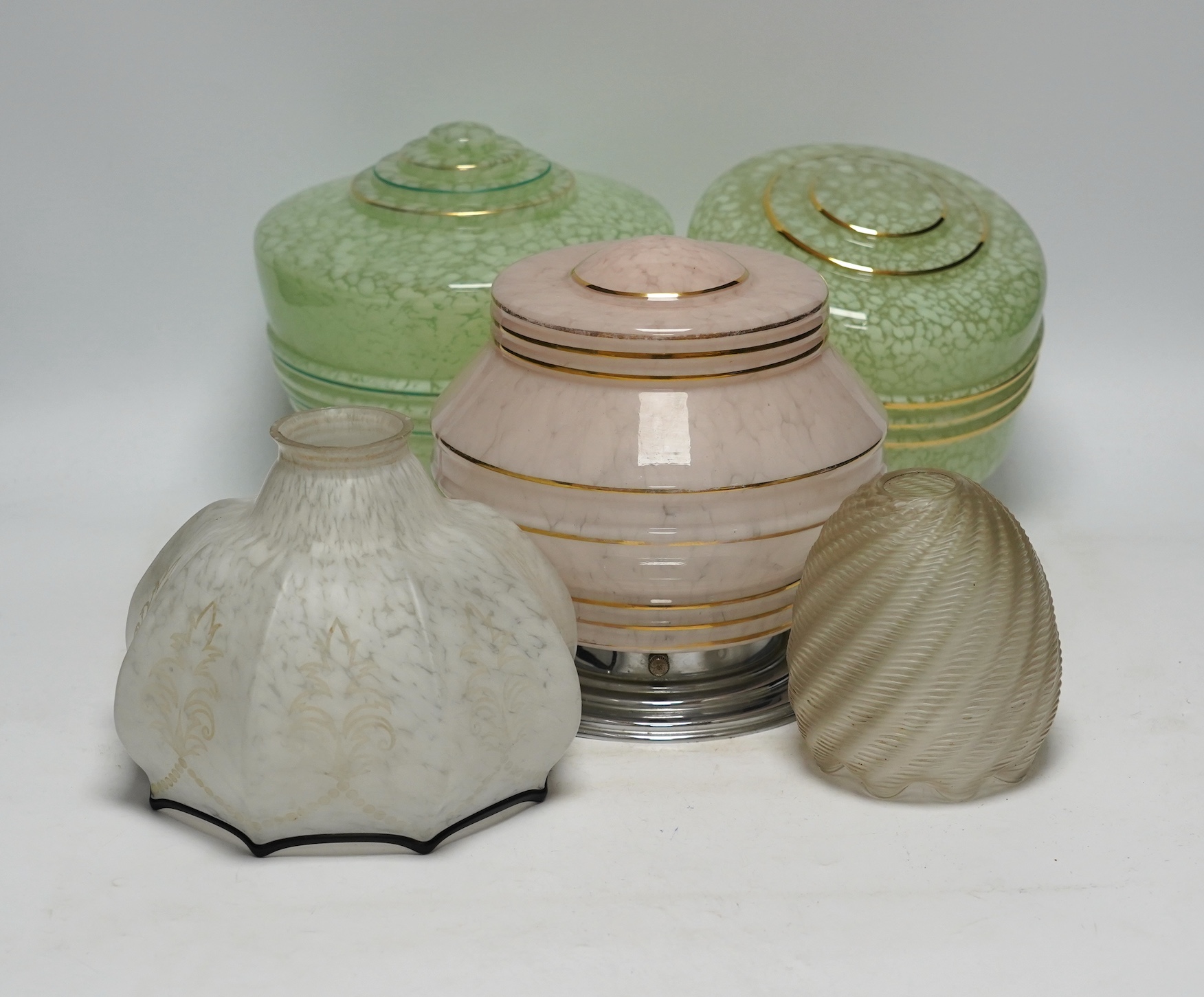 Four Art Deco glass light shades and an earlier glass shade